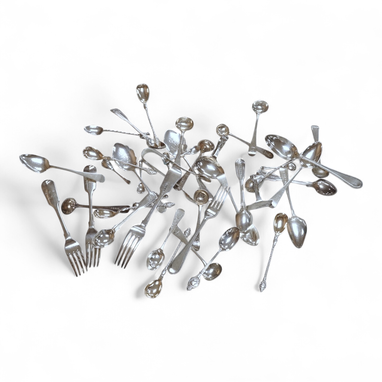 A small collection of assorted mainly 19th century silver flatware, including teaspoons, dessert forks, condiment spoons, serving spoon, etc. various dates and makers, 21.6oz.